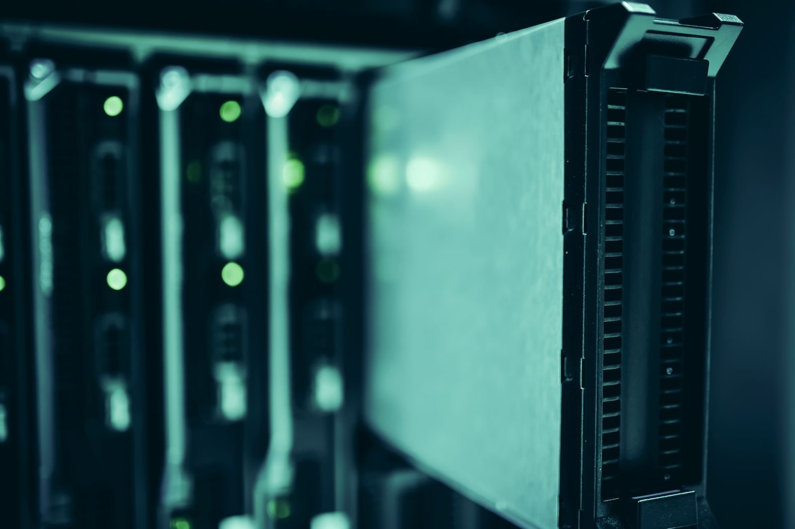 Close-up of active server racks in a blue-lit data center