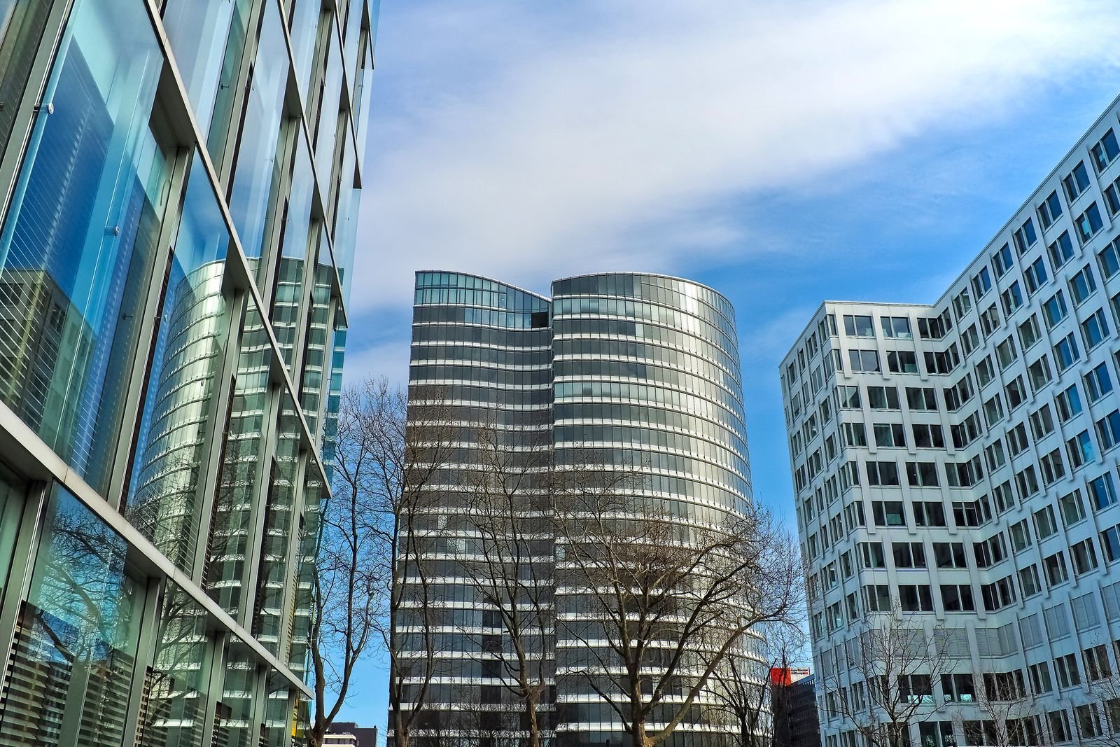 Modern corporate skyscrapers rising against a clear blue sky